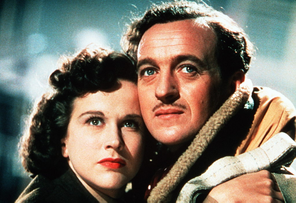 Kim Hunter as June stands cheek-to-cheek with David Niven as Airman Peter Carter.