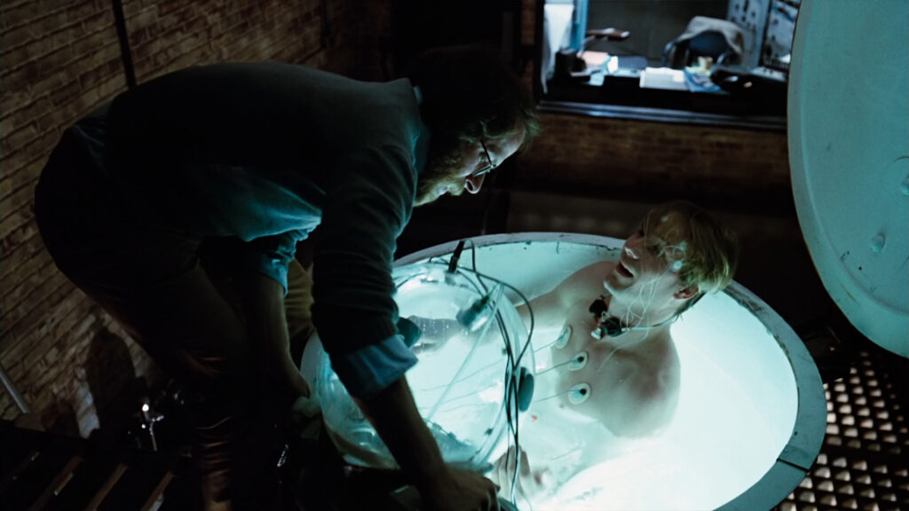 William Hurt emerging from one of his first sensory deprivation tank-induced hallucinatory journeys, monitored by one of his unfailingly supportive colleagues, at the beginning of "Altered States."