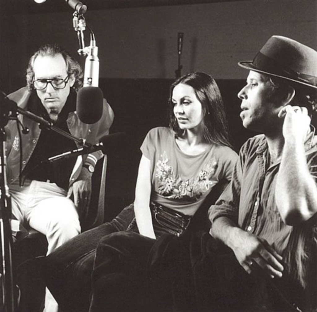 Producer Bones Howe sits next to Crystal Gayle and Tom as they listen to playback in Hollywood’s American Zoetrope studios,