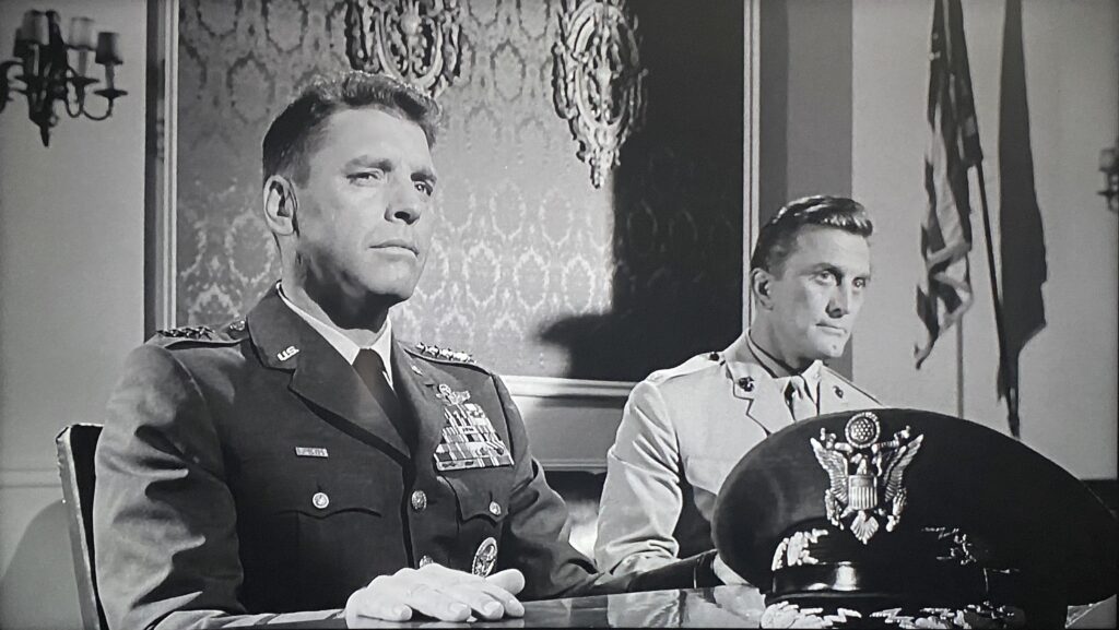 Air Force General James Mattoon Scott (Burt Lancaster) and Colonel Martin J. Casey (Kirk Douglas) take questions from the Senate Armed Services Committee in John Frankenheimer’s Seven Days in May (1964).