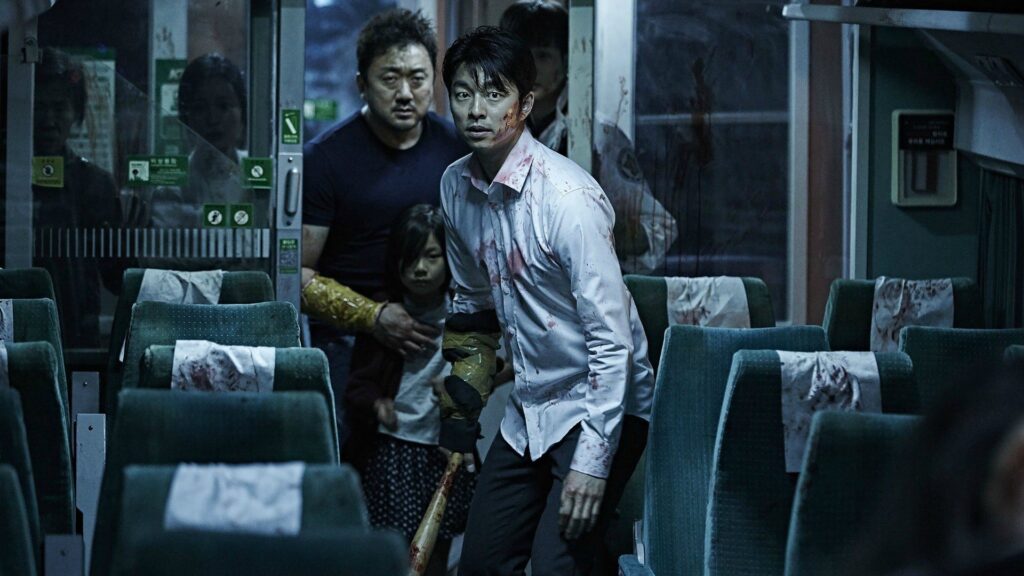 Image of Gong Yoo and Ma Dong-seok preparing to enter a train car full of zombies