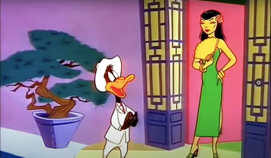 An animated still of Daffy Duck and a stereotyped Chinese woman in a green dress.