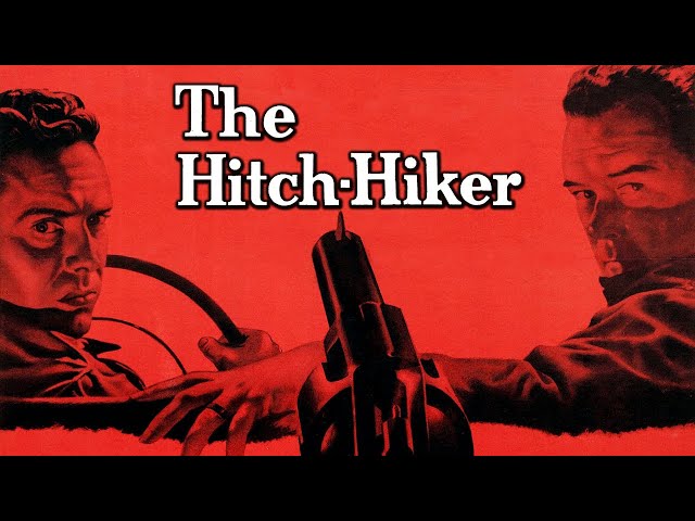 Two men sit in the front seat of a car, looking back at camera. A pistol in the foreground points directly between them. It is black and white with a red transparent overlay and text that reads “The Hitch-Hiker”.