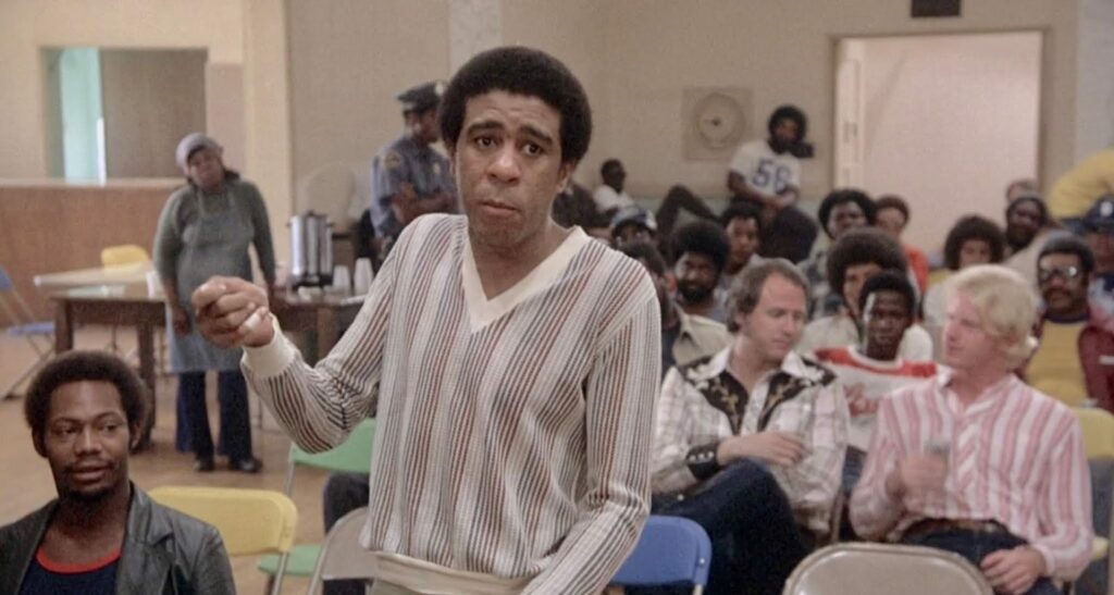 Richard Pryor displaying his bandaged finger before a Union meeting in Blue Collar.