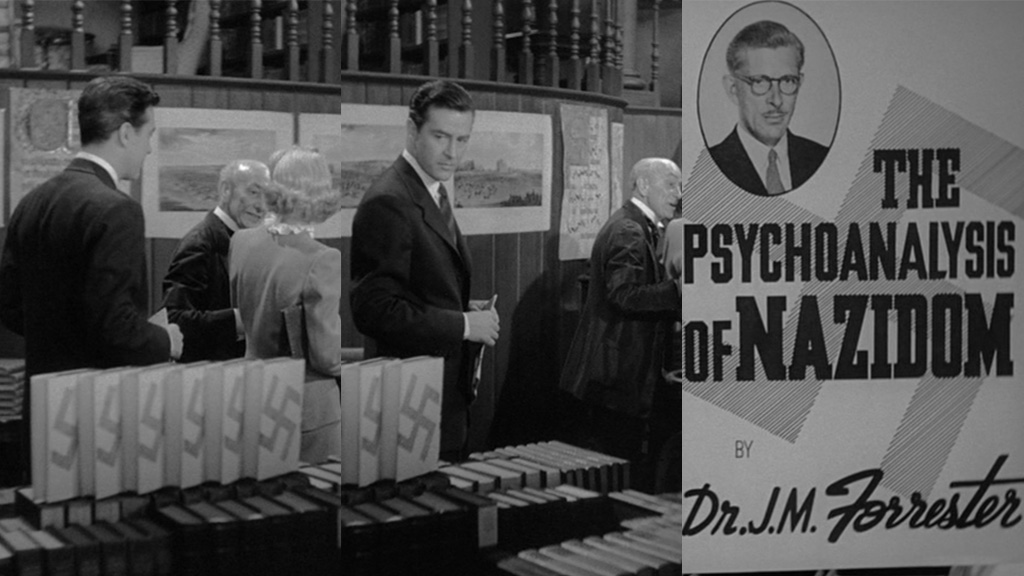 A triptych composed of three stills. In the first, three people walk through a bookstore past a display of books with Swastikas on the back. In the second, Stephen turns to examine the books. The third still reveals that the book is "The Psychoanalysis of Nazis" by Dr. J. M. Forrester, another character in the film