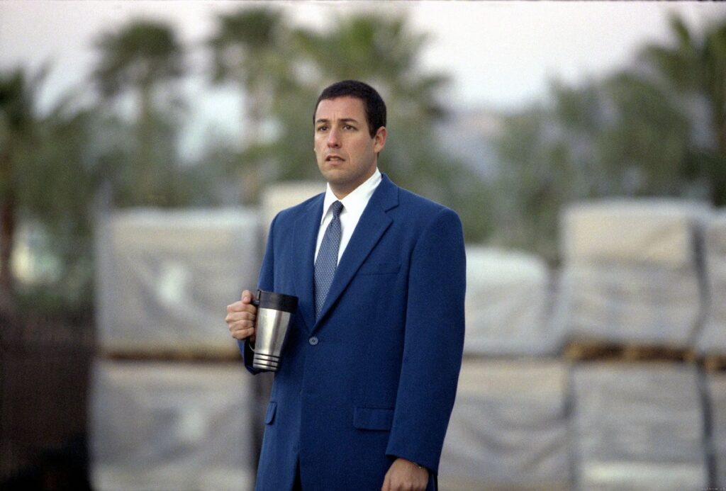 Adam Sandler as Barry Egan in blue suit.